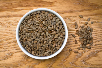 Bowl of Sunflower Seeds on an oak table
