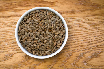 Bowl of Sunflower Seeds on an oak table