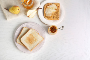 Delicious toasts served for breakfast on wooden table