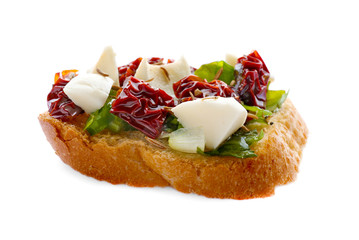 Tasty bruschetta with sun-dried tomatoes on white background