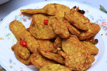 Famous Javanese cuisine food : Tempe or Tempeh made of  fermentation process that binds soybeans into a cake form, sliced and fried. Famous in Indonesia and Malaysia