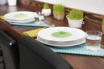 Tasty puree on plate. Table setting in vegetarian cafe