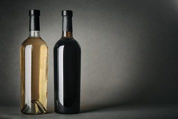 Bottles of wine on gray background