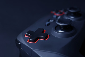 Video game controller on dark background, closeup © Africa Studio