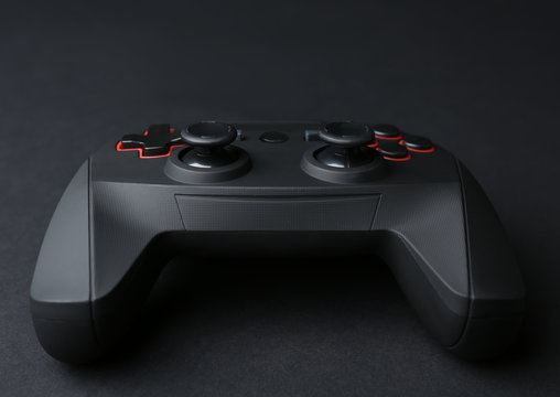 Video game controller on dark background