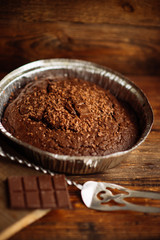 Dark chocolate cake on a wooden table