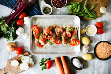 Composition of chicken marinated with pepper and fresh vegetables, semi-finished, top view, flat