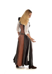 full length portrait of girl wearing brown  fantasy costume, standing pose with back to the camera on white studio background. 