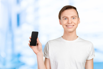 Fototapeta na wymiar Young man showing a blank smart phone screen