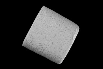 Toilet paper roll isolated on black background, top view