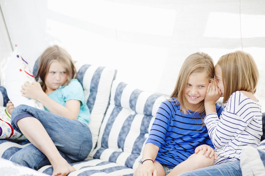 Children talking on sofa