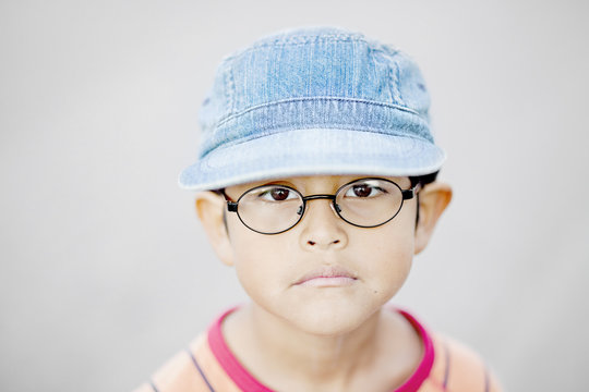 Portrait of boy in glasses and hat