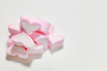 Fototapeta na wymiar white & pink marshmallows hearts clear image Background.