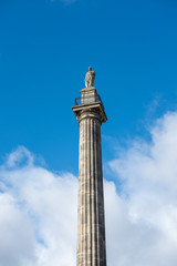Grey's Monument, the monument to Charles Grey, 2nd Earl Grey in the city centre of Newcastle upon Tyne, England. against the blue sky