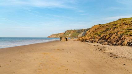 Old bunker and beach at Cayton Bay near Scarborough, North Yorkshire, UK