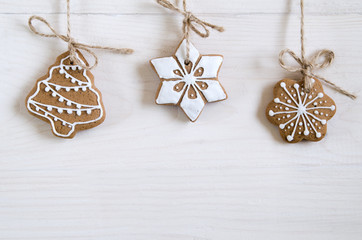 Christmas still life with gifts on a white wooden background with a Christmas tree. New Year gifts
