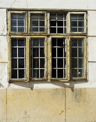 Fototapeta na wymiar Old wood windows in the downtown of Pecs city, Hungary