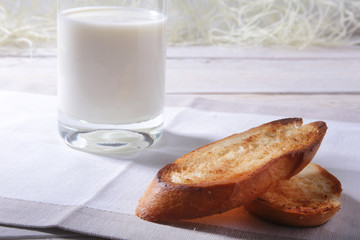 Morning Breakfast set with orange jam on bread toast and milk in glass.
