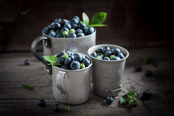 Full of vitamins blueberry in the old metal mug
