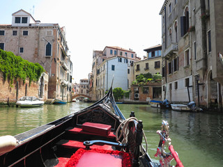 Fototapeta na wymiar 20.06.2017, Venice, Italy: View from gondola to historic buildings and canals