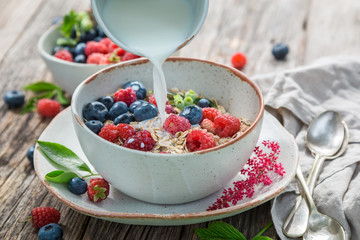 Healthy granola with fresh blueberries and raspberries