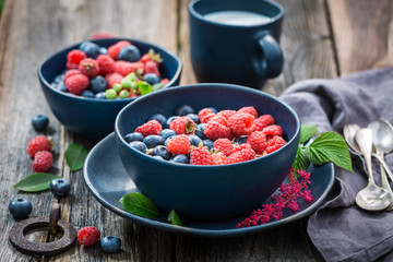 Delicious oat flakes with milk and fresh berry fruits