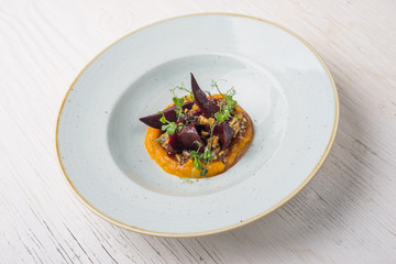 Pumpkin puree with five-spice powder and honey, vegan food in plate