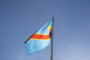 National flag of Congo on a flagpole