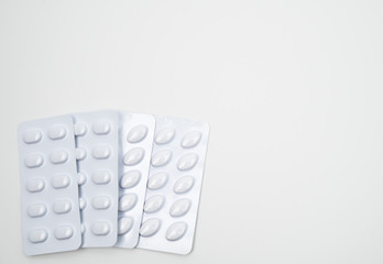 Statins tablets pill in white blister pack for light resistance packaging isolated on white background. Medicine for treatment dyslipidemia. Lipid lowering tablets pills. Statins : Hyperlipidemia.