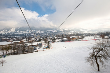 Mountain ski resort cableway, ski lift, in winter