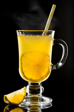 Hot grog with lemon and honey with steam