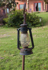 old lantern in green field