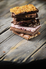 Mix of sweet swiss choccolate on the wooden table