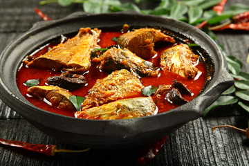 Traditional cuisine from Kerala - fish curry cooked in clay pot.