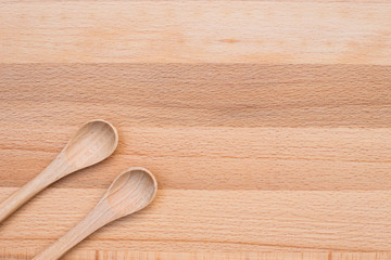Wooden spoon on wooden background