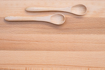 Wooden spoon on wooden background