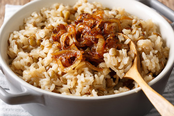 Vegetarian food: rice with lentils and caramelized onion macro. horizontal