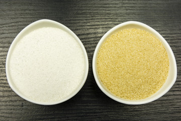 Comparison of white and cane sugar. View from above.