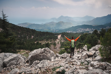 Happy female traveler having her moment in the mountains in Turkey