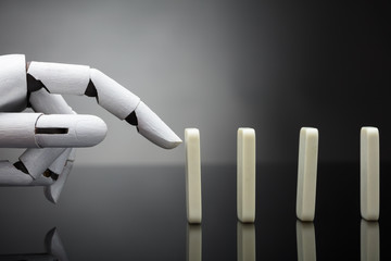 Robotic Hand Pushing Dominos