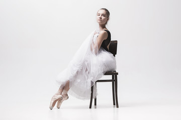 The teen ballerina in white pack sitting on chair © master1305