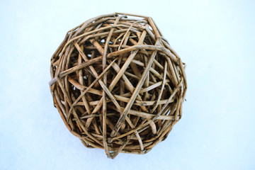 wooden wicker ball on the snow