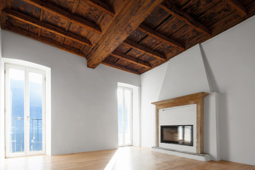 Living room with windows overlooking the lake. Fireplace.