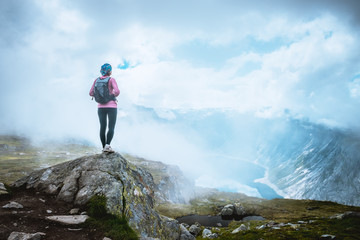 Happy woman enjoy lake in Norway