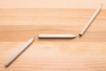 pencils on wooden background