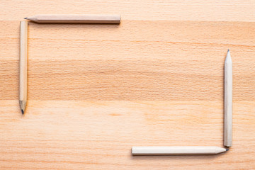 pencils on wooden background
