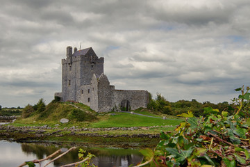Medieval Dungaire Castle against a grey cloudy sky