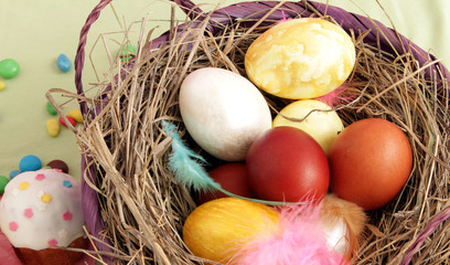 basket with Easter eggs and sweets