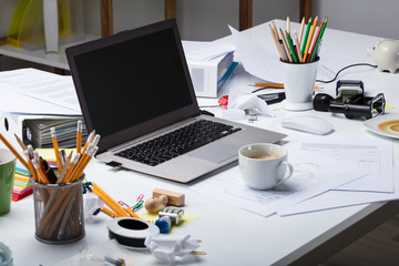 Laptop And Coffee Cup Over The Desk