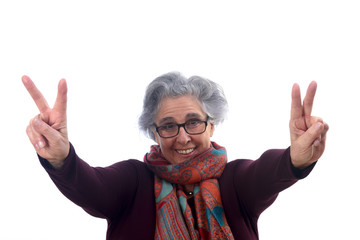 senior woman with victory sign on white